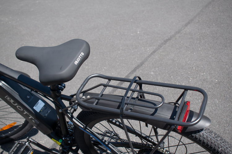 Comfortable padded saddle with sturdy rear steel rack, rated for 25 kg load