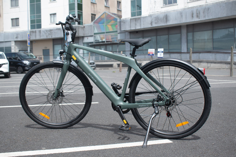 Carbon fiber electric bike with 700c wheels and mid-drive motor, lightweight design