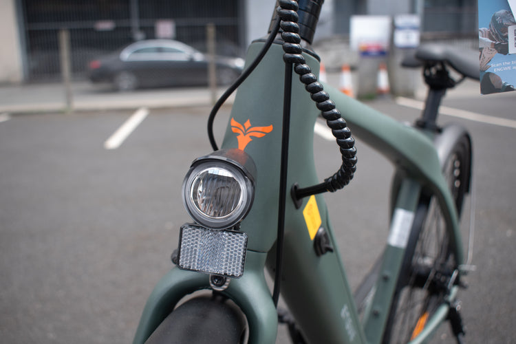 Carbon fiber electric bike with 700c wheels and mid-drive motor, lightweight design
