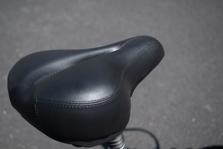 Comfort seat with rear suspension – electric bicycle close-up"